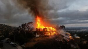 Hollywood Hills Fire Engulfs Home Amidst Strong Winds, Challenging LAFD Response