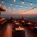 Sophisticated Los Angeles rooftop bar at dusk with panoramic city views, reflecting the aspirational and vibrant nightlife.